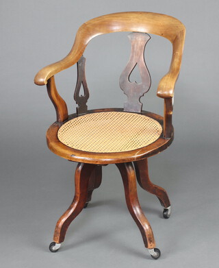 A Victorian bleached mahogany tub back office chair with circular woven cane seat raised on outswept supports 87cm h x 59cm w x 51cm d (seat 31cm diam.) 