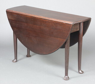 A Georgian oval drop flap mahogany dining table raised on club supports 70cm h x 111cm w x 32cm d 