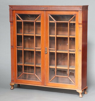 A 19th Century mahogany bookcase (formerly the top of a bureau bookcase), fitted adjustable shelves enclosed by astragal glazed panelled doors with bevelled glass, raised on cabriole supports 129cm h x 116cm w x 26cm d 