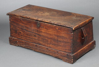 An 18th Century elm coffer of tapered form and hinged lid 42cm h x 96cm w x 41cm d 