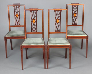 A set of 4 Edwardian inlaid mahogany pierced and slat back dining chairs with upholstered seats, raised on square tapered supports 100cm h x 42cm w x 40cm d (seats 20cm x 29cm) 