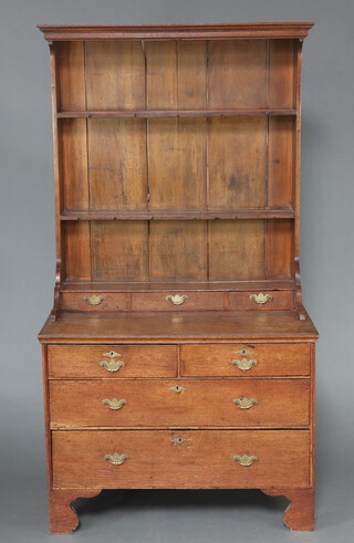 An 18th Century oak dresser, the raised back with moulded cornice fitted 2 shelves above 3 long drawers, the base fitted 2 short and 1 long drawer 197cm h x 107cm w x 62cm d (possibly made up) 