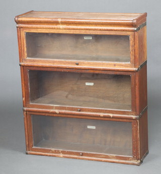 An oak 3 tier Globe Wernicke bookcase with glazed panelled doors 101 cm h x 86cm w x 26cm d  