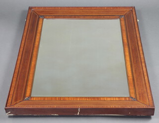 An Edwardian rectangular bevelled plate mirror contained in an inlaid mahogany frame with fleur de lis decoration to the cornice 118cm h x 86cm w