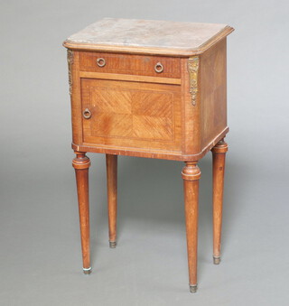 A 19th Century French inlaid Kingwood bedside cabinet with pink veined marble top, fitted a drawer above cupboard enclosed by panelled doors, raised on turned supports with gilt metal mounts 82cm h x 48cm w x 37cm d 