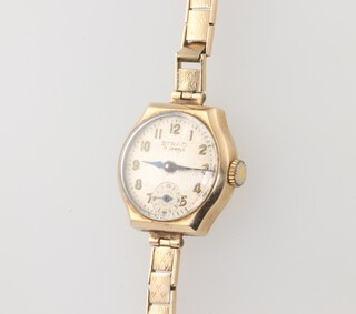 A lady's Strad wristwatch contained in a 9ct gold case with integral bracelet, case including glass weighs 19.3grams 