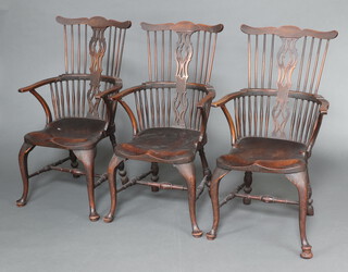 A set of 3 18/19th Century Windsor elm and beech stick and bar back carver chairs with saddle seats, raised on cabriole supports with H framed stretcher 104cm h x 47cm w x 56cm d (seats 25cm x 32cm) 