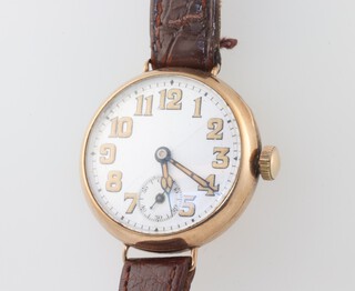A Denco wristwatch with enamelled dial Arabic numerals, contained in a 9ct gold case, the reverse with inscription - To Mr J L Tomlinson 1926 Paris.Savoy Geneva 