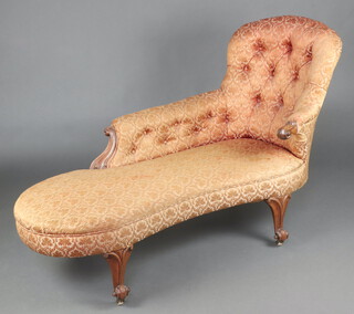 A Victorian mahogany show frame chaise longue with raised back, upholstered in buttoned floral material  95cm h x 140cm w x 53cm d (seat 110cm x 30cm) 