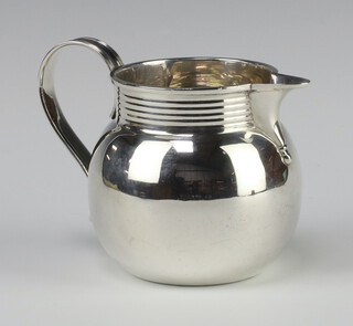 A Georgian style silver jug with ring turned lip, London 1954, 211 grams, 9cm 