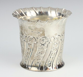 A Victorian repousse silver flared neck vase with floral decoration Sheffield 1867, 10cm, 166 grams 