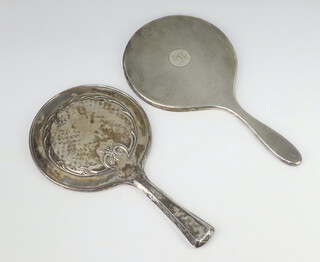 A silver engine turned hand mirror London 1912 and 1 other silver backed hand mirror