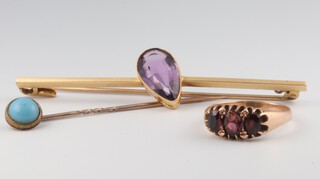 A yellow metal 15ct amethyst bar brooch, a yellow metal garnet ring (a/f) size P and a stick pin, gross weight 10.5 grams 