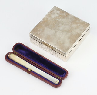 A silver square cigarette box Birmingham 1962 together with a gold mounted mother of pearl cigarette holder in a leather case 