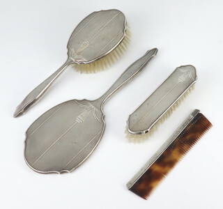 A silver 4 piece dressing table set with engine turned decoration Birmingham 1949 