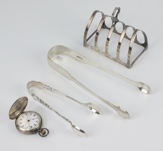 A silver arched 5 bar toast rack Birmingham 1933, 2 pairs of sugar nips and a silver fob watch, weighable silver 107 grams 