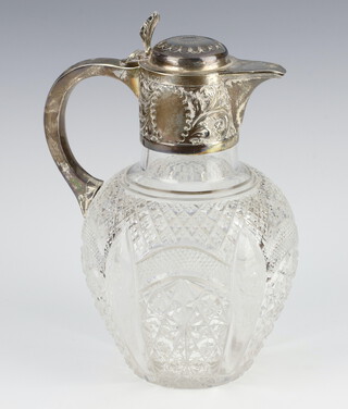 A Victorian silver mounted cut glass ewer with scroll mounts, shell thumb piece and C scroll handle, Sheffield 1898, 20 cm