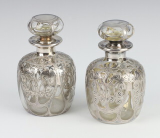 A pair of Art Nouveau style silver mounted glass scents 12cm 