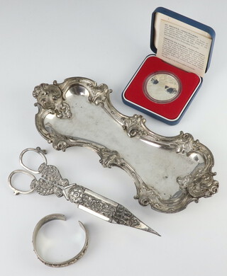 A pair of silver plated candle snuffers and tray, bangle and a 1977 commemorative crown 