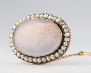 A 19th Century yellow metal seed pearl and enamel oval brooch inscribed "A birthday gift from my sister Hannah, January 25th 1867, in memory of Thomas Watts who died July 2nd 1865, Harriet Watts who died September 20th 1865" 40mm x 30mm 