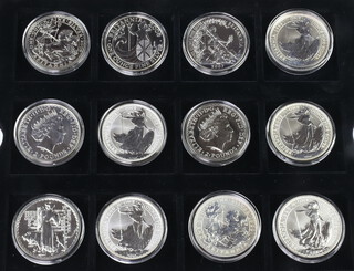 Twelve commemorative silver Britannia coins 1998-2009 each 32 grams 
