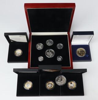 A King Edward VIII 1936 New Strike patent set of silver coins, a silver two pound coin, a silver gilt commemorative crown, a silver two pound coin and two others, 170 grams  