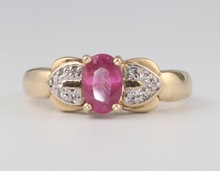 A yellow metal 9k oval pink tourmaline and diamond ring 3.5 grams, size N 