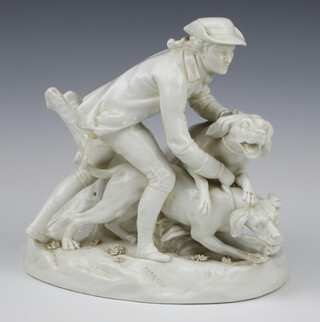 A 19th Century German white glazed figure of a huntsman and hounds 25cm 
