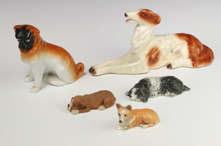 A Branksome china figure of a reclining Spaniel 12cm, ditto of a Corgi 9cm, a Continental seated pug 13cm and a German hound 25cm, together with a composition dog  