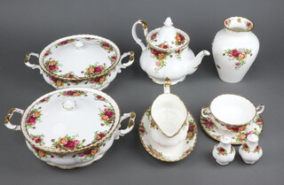 A 57 piece Royal Albert Old Country Rose pattern dinner service comprising 2 tureens and covers, oval meat plate, 8 dinner plates (2 are seconds), a 1980 first edition calendar plate, teapot, 8 tea plates (1 a second), 8 saucers (2 seconds), 7 twin handled soup bowls, 8 small bowls, large jug, circular bowl (second), 2 sauce boats and stands (1 boat and stand a second),  twin handled bowl, 2 peppers, 2 ashtrays, cheese knife boxed and a vase 