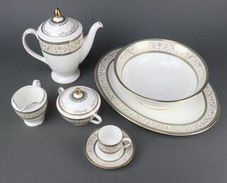 A Minton Aragon pattern part coffee and dinner service comprising 6 coffee cans, 6 saucers, 8 small plates, 8 medium plates, 8 side plates, 8 dinner plates, 8 dessert bowls, 8 soup bowls, coffee pot, sugar basin and cover, milk jug, sauce boat stand, oval meat plate and large bowl