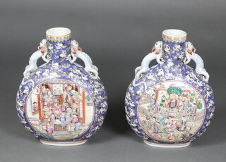 A pair of large and impressive 20th Century Chinese pottery moon shaped flasks decorated courtly figures 48cm 