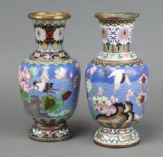 A pair of blue ground cloisonne enamelled vases decorated storks in landscape 27cm 