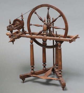 A 19th/20th Century turned wooden model of a spinning wheel 34cm x 24cm x 20cm 