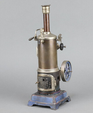 A stationary steam engine complete with burner, raised on a blue and red painted base 37cm x 11cm x 11cm 