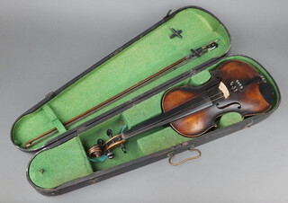 A violin with 2 piece back labelled "Jacobus Stainer in Absam Prope Oenipontum 1760", complete with bow, contained in a wooden carrying case 