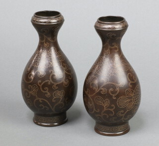 A pair of 19th Century Japanese bronze club shaped vases with floral decoration and Grecian key pattern to base 15cm 