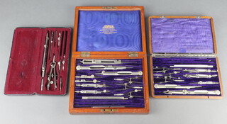A W H Harling part geometry set contained in a mahogany box, 1 other part set in a mahogany box and another in a fibre case 