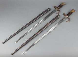 Two French chassepot bayonets, 1 with blade marked 1871, the other 1875, complete with scabbards  