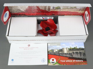 Paul Cummins, "Blood, Sweat, Lands and Sea of Red" a 2014 ceramic poppy, boxed and complete with certificate, from the display at The Tower of London  