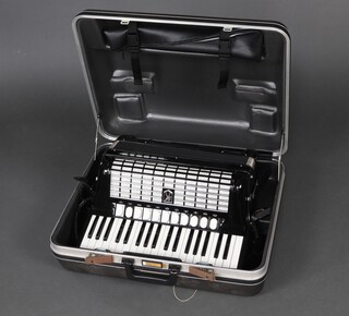 A Hohner Tango IV T accordion with 96 buttons, cased 