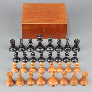 A late 19th century Staunton wooden chess set, all contained in a fitted mahogany box with hinged lid marked Staunton Chessmen