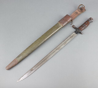 A Remington First World War bayonet marked Remington 1917 complete with scabbard