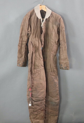 A Second World War Type H flying suit, labelled code no. 8848, stores reference 22C/1013 Type H Medium together with an Air Ministry rain cape no.1869409 