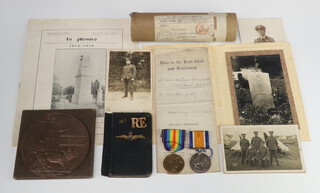A posthumous RAF First World War pair of medals comprising British War medal and Victory medal together with death plaque to Second Lieutenant James William Howard RAF, 99 Squadron Royal Air Force, with scroll, letter from The King in original posting tube, slip concerning transmission of plaque, Royal Flying Corps sweetheart brooch, Royal Engineer shoulder title, telegram and envelope, a telegram from The King, last will and testament, photograph of the recipient in Observers Uniform, 8 other photographs, a postcard of the cemetery in which interned and photograph of the grave, death announcement in newspaper, programme for the dedication of the Southampton War Memorial on which he is named, together with a 1918 diary with various jottings  