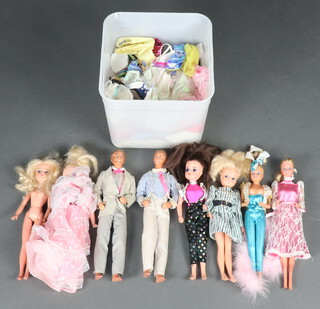 A collection of 1970/80's Sindy (x4), Barbie (x2) and Ken (x2) dolls, together with a collection of outfits 