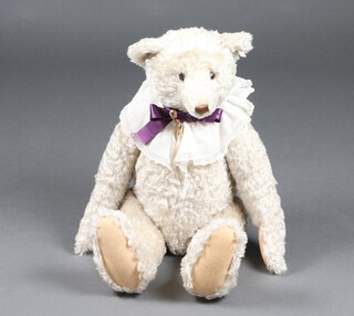 A limited edition 1994 Replica bear of a 1908 teddy bear, limited edition no. 2085/7000, gold button and label to ear in white mohair, with growl box, approx. 47cm h, seated, unboxed