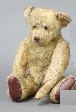 An early 20th Century Steiff mohair teddy bear with articulated limbs, stuffed with wood wool and non working growl box 40cm  