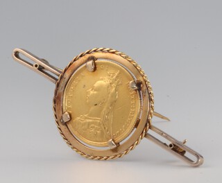 A sovereign 1889 in a yellow metal mount, gross weight 14 grams 