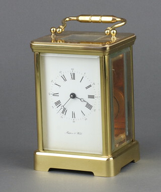 Mappin and Webb, a 20th Century carriage timepiece with enamelled dial, Roman numerals contained in a gilt metal case 13cm h x 9cm x 8cm, complete with key 